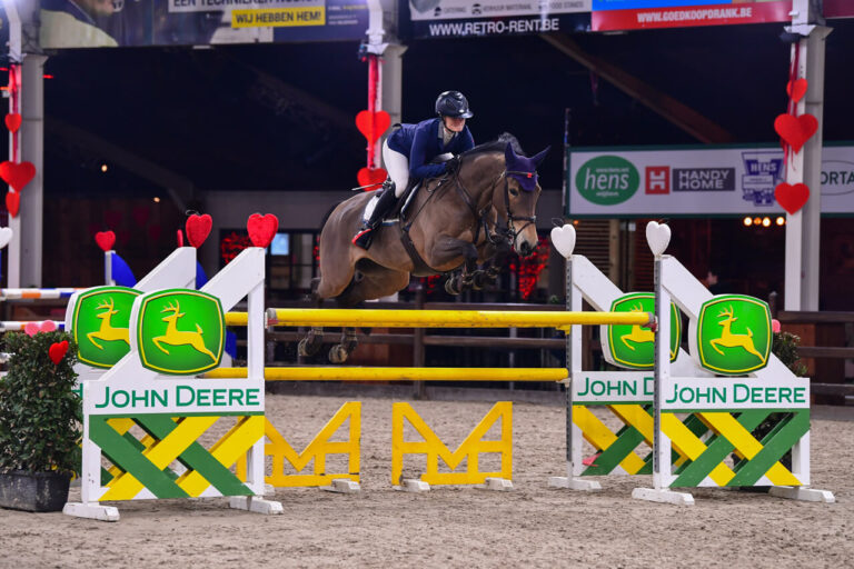 Show Jumper Epona with Emilie Stampfli jumping over obstacle