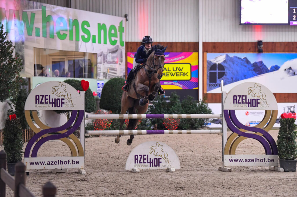 Show Jumper Firenze with Emilie Stampfli jumping over obstacle