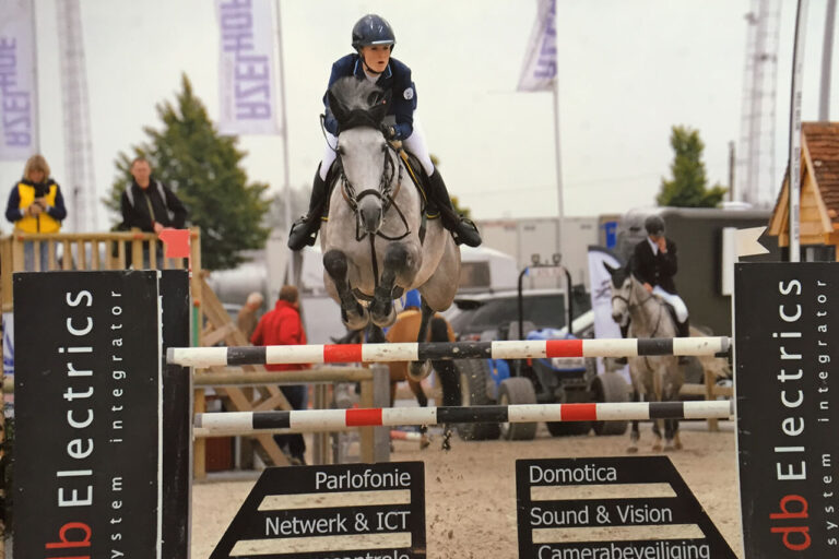 Show Jumper Brigand with Emilie Stampfli jumping over obstacle