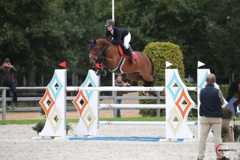 Show Jumper Gabrielle with Emilie Stampfli jumping over obstacle