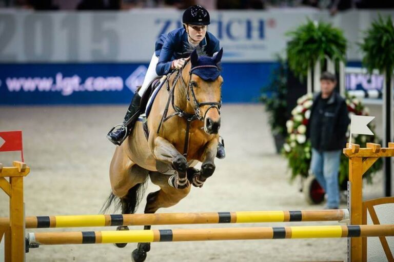 Show Jumper Nikita with Emilie Stampfli jumping over obstacle